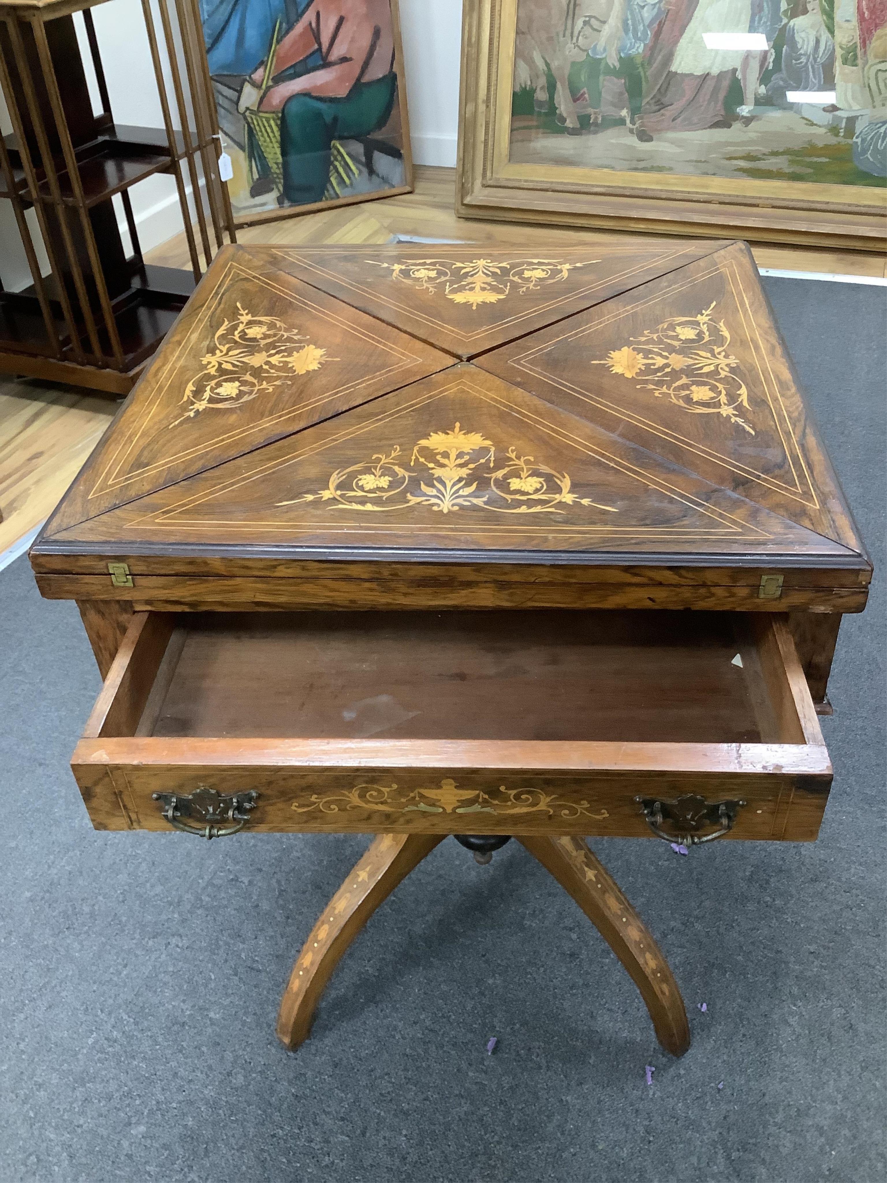 A late Victorian inlaid rosewood envelope card table, width 55cm, depth 55cm, height 71cm. Condition - fair